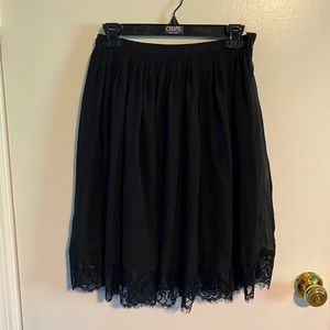 Black chiffon skirt.
